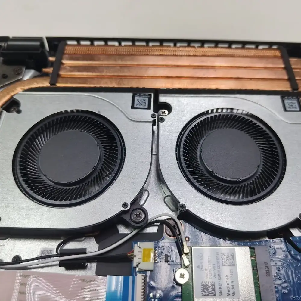 Dual laptop cooling fan inspection