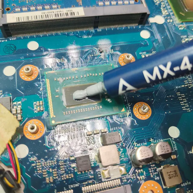 Arctic MX 4 thermal paste on Intel CPU closeup