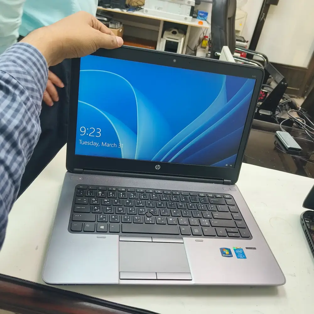 An HP ProBook laptop running Windows 11 on a repair bench during diagnostics