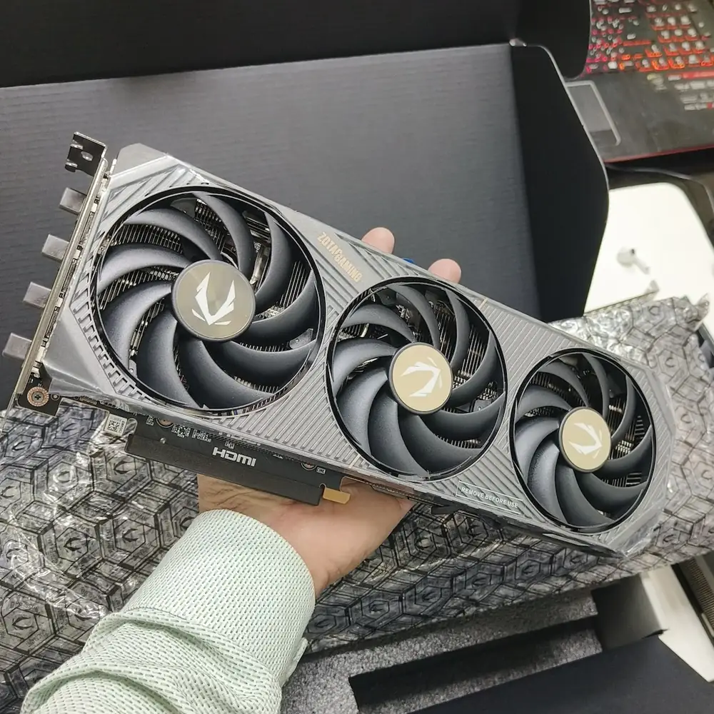 A gaming graphics card being upgraded, with power supply cabling visible